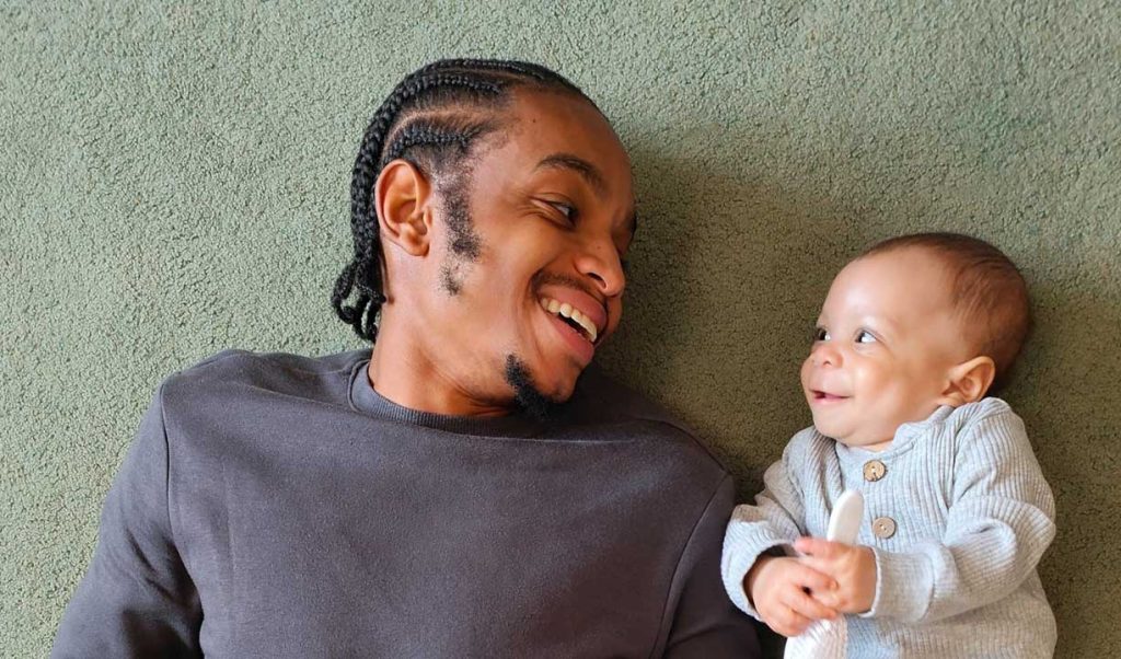 Attachment and bonding: father smiling at baby boy